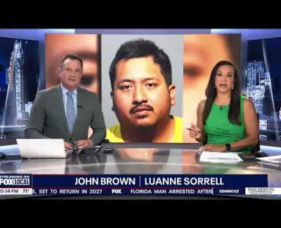 News anchors John Brown and Luanne Sorrell report with a suspect's mugshot on a FOX local broadcast.