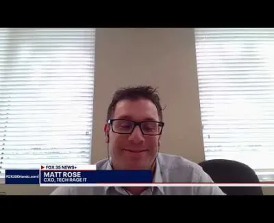 Man with glasses and earbuds in front of windows appears in a Fox 35 News video call segment