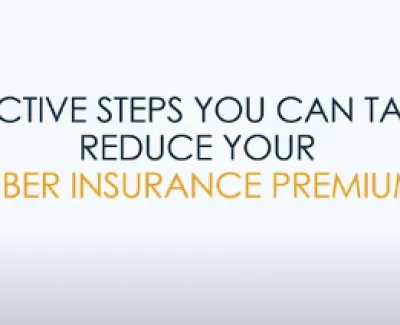Proactive steps to reduce cyber insurance premiums text on a clean white background design.