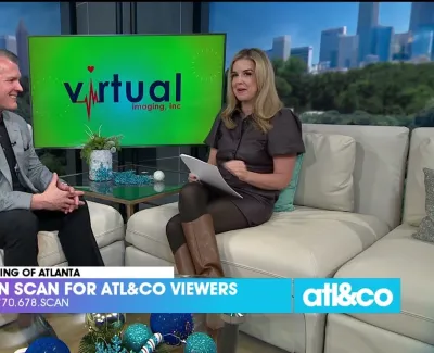 Two hosts on a TV set discuss Virtual Imaging's free heart and brain scan offer for Atlanta viewers.
