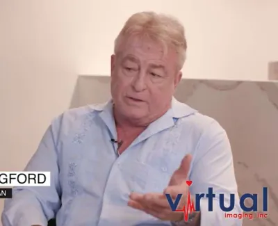 Greg Langford, stand-up comedian, speaking in an interview with Virtual Imaging Inc. branding visible.