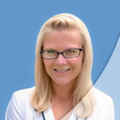 Smiling female doctor with glasses and stethoscope wearing a white coat against a blue background