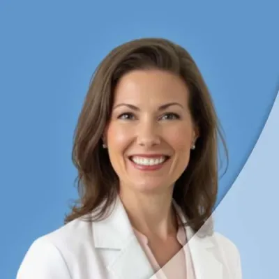Smiling woman in white medical coat against a blue background, symbolizing healthcare or professionalism