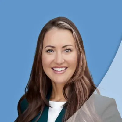 Smiling woman with brown hair wearing a light blue top against a blue background with curved graphic overlay.