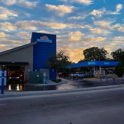a gas station with a blue sign