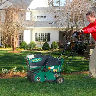 a man pushing an aerator