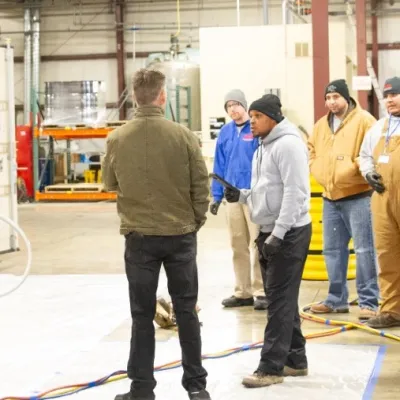 a group of people training at USA Insulation