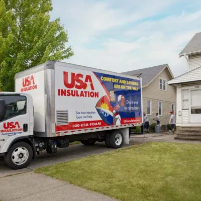 a white truck parked in front of a house