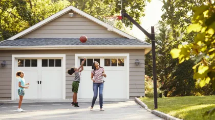 a group of people playing basketball