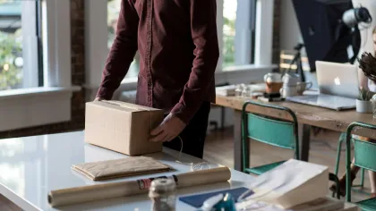a person opening a box
