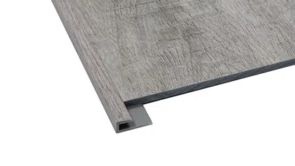 Gray wood-look vinyl flooring plank with textured grain and integrated edge trim for easy installation.