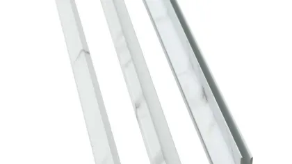 Three white marble-patterned plastic edge trim strips of different cross-sectional shapes on white background