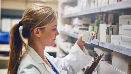 a woman in a white coat