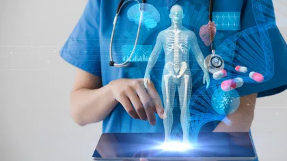 a person holding a model of a human body