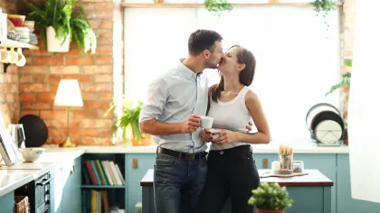 a man and woman kissing