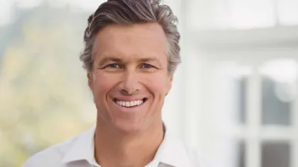a close-up of a man smiling