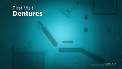 Dental clinic interior with patient chair and equipment, highlighting first visit for dentures treatment.