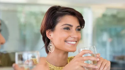 a woman holding a glass of wine