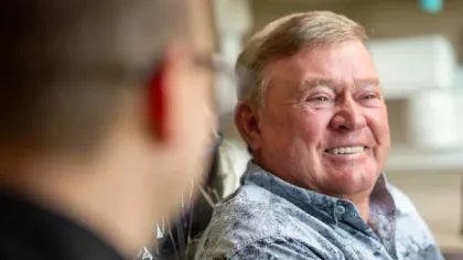 a man smiling at something