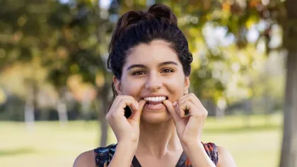 a person putting in clear aligner