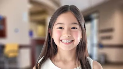 a girl smiling for the camera