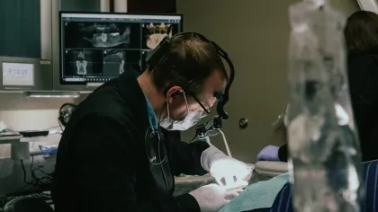 dr langan performing oral surgery