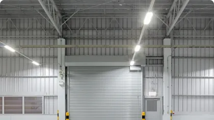 a large empty room with a large white door and a large white wall
