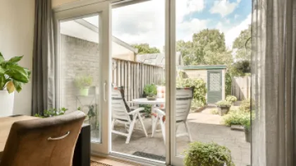 a patio with a table and chairs
