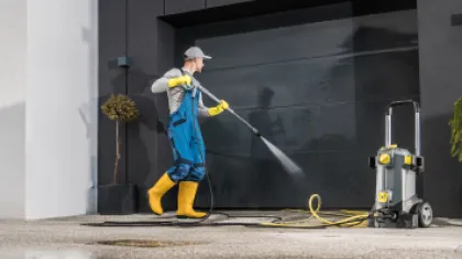 a person spraying water on a fire hydrant