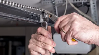 a person holding a piece of metal