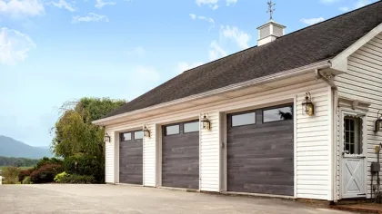 a house with garages and a steeple
