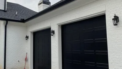 a white house with a black door