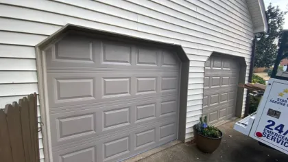 a garage door with a planter