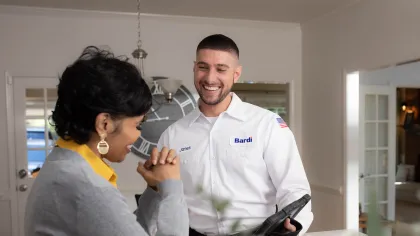 a doctor showing a patient something on the phone