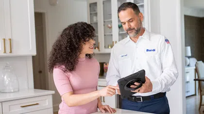 Customer reviewing a gas line installation repair quote
