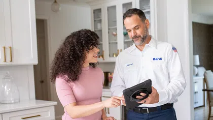 Customer reviewing repipe estimates and options with bardi