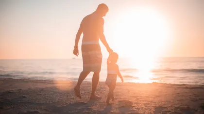 a woman standing on a beach