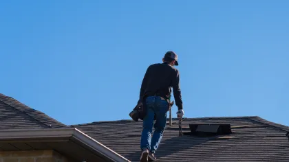 a man walking on a roof