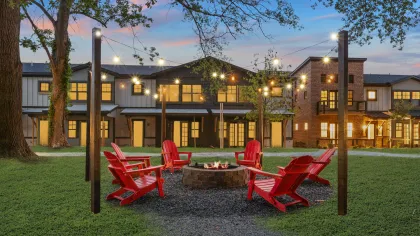 a building with a few tables and chairs outside