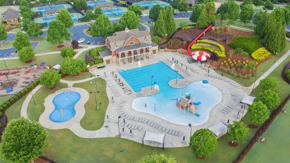 a pool with a building in the background