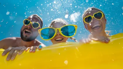 a group of people in a pool wearing goggles