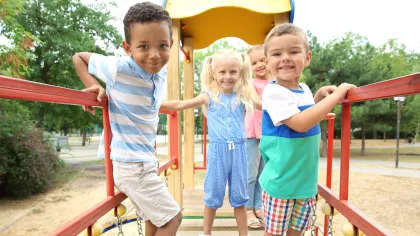 a group of children playing on a playground