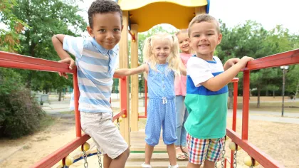 a group of children playing on a playground
