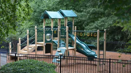 a small play structure in a park