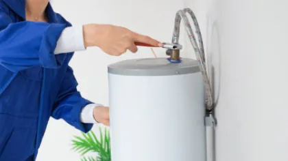 a person fixing a water heater