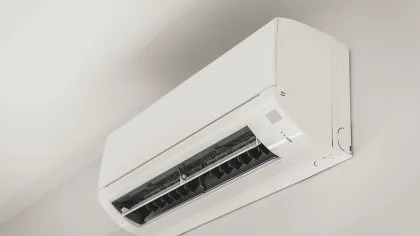 Ductless mini-split air conditioning unit installed indoors for targeted home cooling.