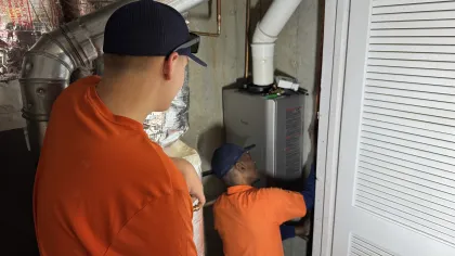 Estes Services Plumbers  installing a tankless water heater
