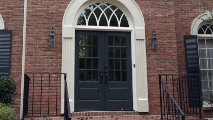 a brick building with a door and windows