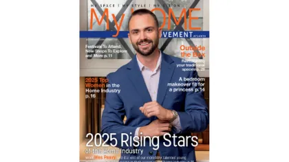 Smiling man in a blue suit on cover of My Home Movement magazine August 2025 edition