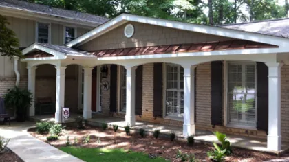 a house with a brick front yard
